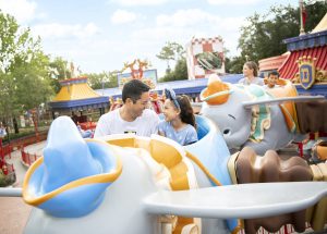 A family riding Dumbo at Walt Disney World