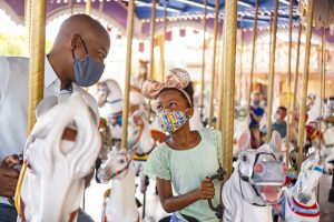 A parent and a child on the carousel