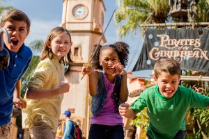 Four children outside the Pirates of the Caribbean ride