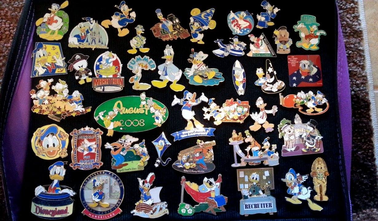 A collection of disney pins for trading which were purchased in