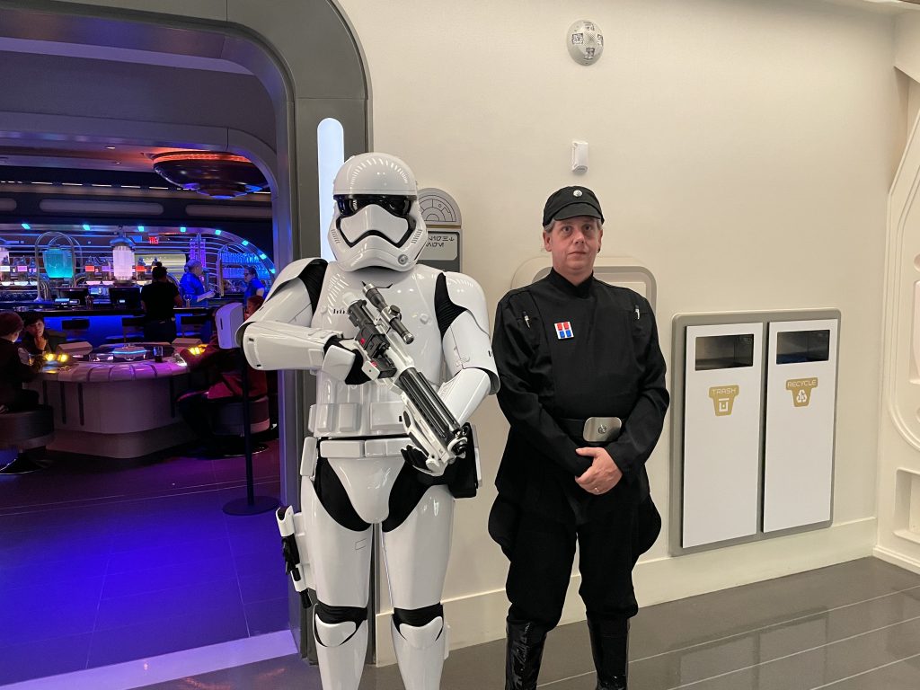 Travel Agent Jay and a storm trooper board the Galactic Starcruiser